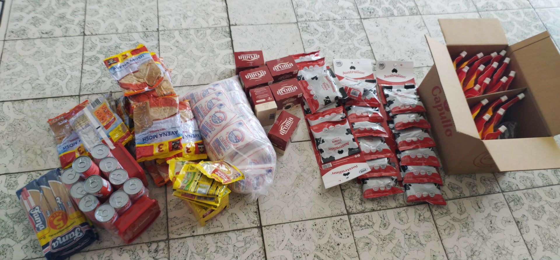 Recipient holding a delivered food support package