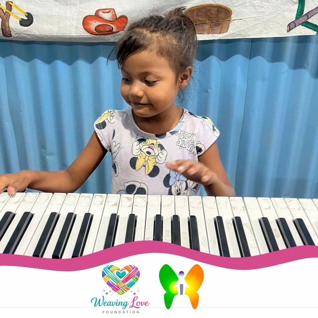 Three children practicing keyboards together