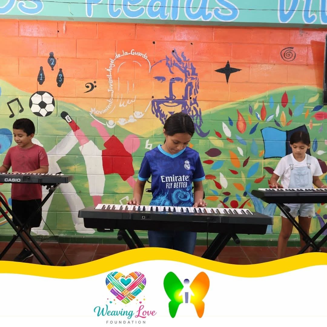 Adult participant at a keyboard during the music program